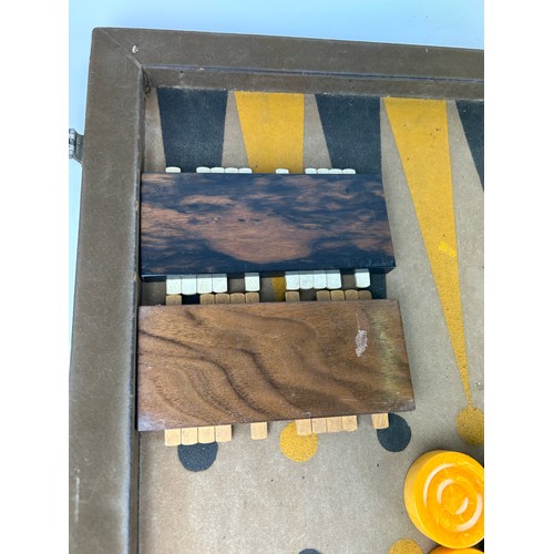 148 - AN ART DECO BACKGAMMON SET, cased

72cm x 54cm when open

**Please note this lot will be available f... 