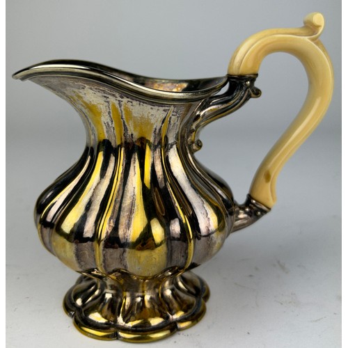 127 - A SILVER PLATED AND GILT JUG WITH BONE HANDLE

12cm in height

**Please note this lot will be availa... 