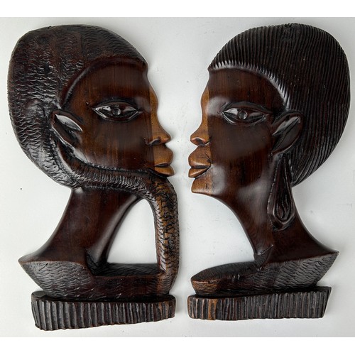 146 - A PAIR OF AFRICAN BOOKENDS DEPICTING LADIES HEADS, adapted into wall hangings

28cm x 16cm each

**P... 