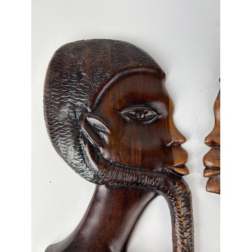 146 - A PAIR OF AFRICAN BOOKENDS DEPICTING LADIES HEADS, adapted into wall hangings

28cm x 16cm each

**P... 