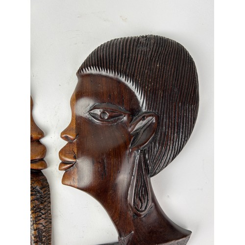 146 - A PAIR OF AFRICAN BOOKENDS DEPICTING LADIES HEADS, adapted into wall hangings

28cm x 16cm each

**P... 