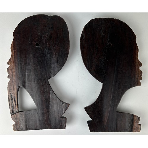 146 - A PAIR OF AFRICAN BOOKENDS DEPICTING LADIES HEADS, adapted into wall hangings

28cm x 16cm each

**P... 