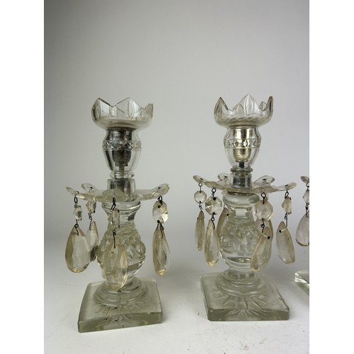 143 - A SET OF FOUR GLASS CANDLESTICKS WITH DROPS (4)

23cm in height

**Please note this lot will be avai... 