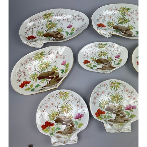 84 - A WEDGWOOD SHELL DESIGN PART DINNER SERVICE IN THE JAPANESE STYLE, painted with flowers and rocky ou... 