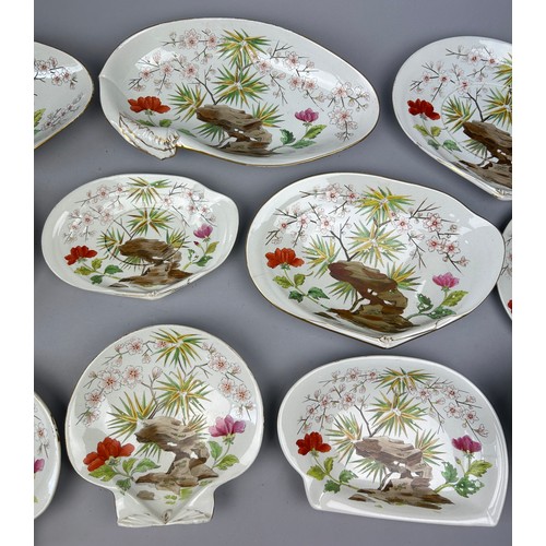 84 - A WEDGWOOD SHELL DESIGN PART DINNER SERVICE IN THE JAPANESE STYLE, painted with flowers and rocky ou... 