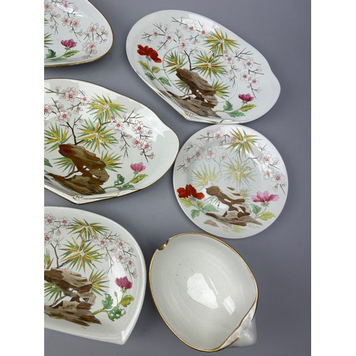 84 - A WEDGWOOD SHELL DESIGN PART DINNER SERVICE IN THE JAPANESE STYLE, painted with flowers and rocky ou... 