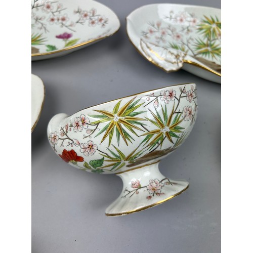 84 - A WEDGWOOD SHELL DESIGN PART DINNER SERVICE IN THE JAPANESE STYLE, painted with flowers and rocky ou... 