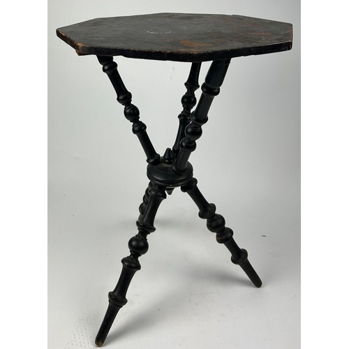 225 - A VICTORIAN EBONISED SIDE TABLE WITH UNUSUAL TRIPOD SUPPORTS AND BASE

65cm in height x 45cm in widt... 