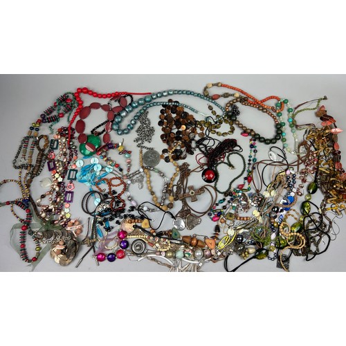 284 - A LARGE QUANTITY OF COSTUME JEWELLERY, to include mother of pearl, beaded necklaces and more (Qty)