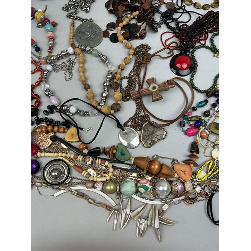 284 - A LARGE QUANTITY OF COSTUME JEWELLERY, to include mother of pearl, beaded necklaces and more (Qty)