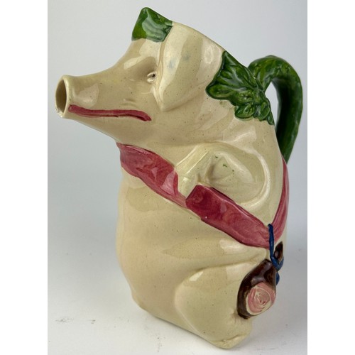 90 - A MAJOLICA PIG JUG, depicting a pig holding a ham

22cm in height

**Please note this lot will be av... 