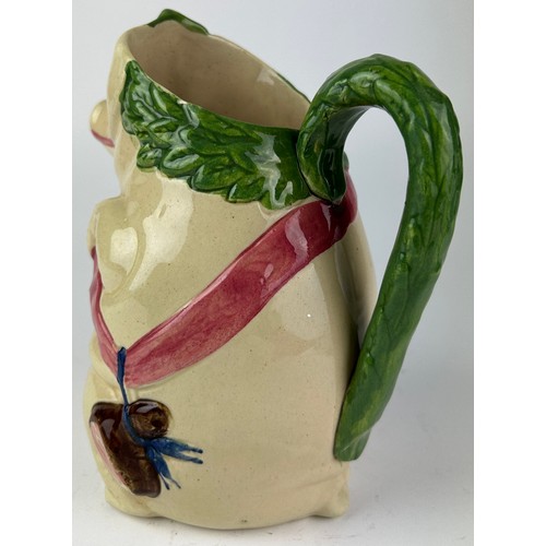 90 - A MAJOLICA PIG JUG, depicting a pig holding a ham

22cm in height

**Please note this lot will be av... 