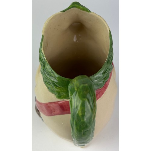 90 - A MAJOLICA PIG JUG, depicting a pig holding a ham

22cm in height

**Please note this lot will be av... 