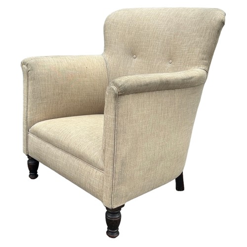 231 - A CONTEMPORARY ARMCHAIR BUTTON BACK UPHOLSTERED IN OATMEAL NEUTRAL FABRIC, raised on turned legs wit... 