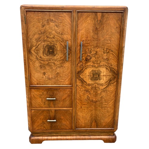 229 - AN ART DECO BURR WALNUT CABINET, with six inner compartments, one with two sliding drawers

124cm x ... 