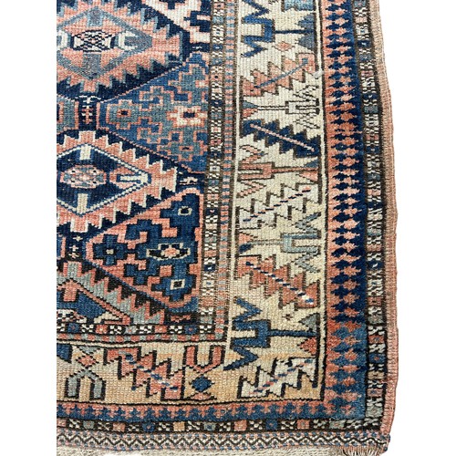 248 - AN ANTIQUE PERSIAN KILIM RUG, 

Faded and worn.

205cm x 130cm

**Please note this lot will be avail... 