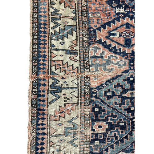 248 - AN ANTIQUE PERSIAN KILIM RUG, 

Faded and worn.

205cm x 130cm

**Please note this lot will be avail... 