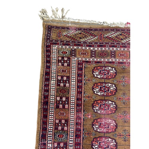 250 - A PERSIAN RUG, 

Faded and damaged

**Please note this lot will be available for collection at an of... 