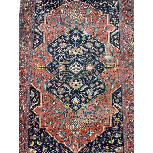 251 - AN ANTIQUE PERSIAN RUG, floral design

186cm x 136cm

**Please note this lot will be available for c... 