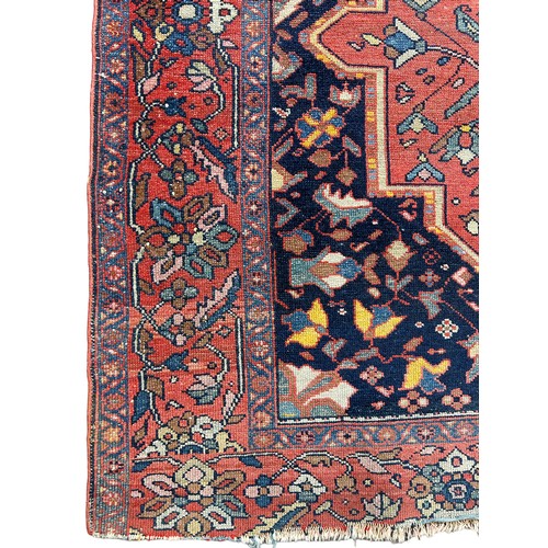 251 - AN ANTIQUE PERSIAN RUG, floral design

186cm x 136cm

**Please note this lot will be available for c... 