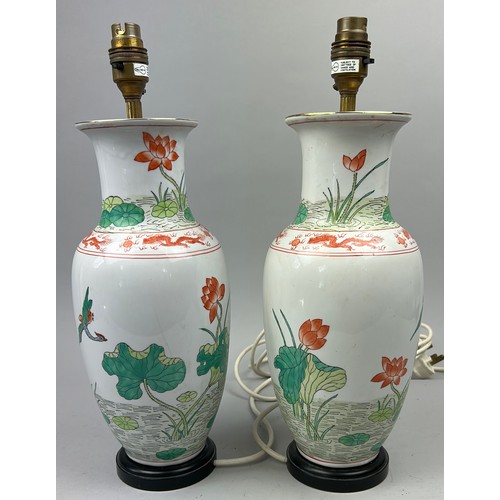 163 - A PAIR OF CHINESE PORCELAIN VASES ADAPTED INTO LAMPS, hand painted depicting cranes and lily pads (2... 