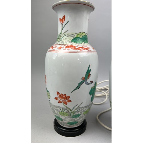 163 - A PAIR OF CHINESE PORCELAIN VASES ADAPTED INTO LAMPS, hand painted depicting cranes and lily pads (2... 