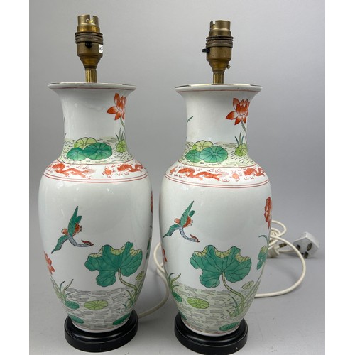 163 - A PAIR OF CHINESE PORCELAIN VASES ADAPTED INTO LAMPS, hand painted depicting cranes and lily pads (2... 