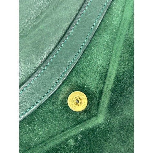 290 - A VINTAGE GUCCI PURSE WITH HAND CLIP, green suede with dustbag