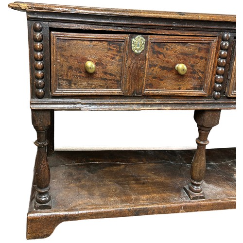 236 - A CHARLES II DRESSER OAK DRESSER BASE CIRCA 1690, possibly later additions,

The rectangular plank t... 