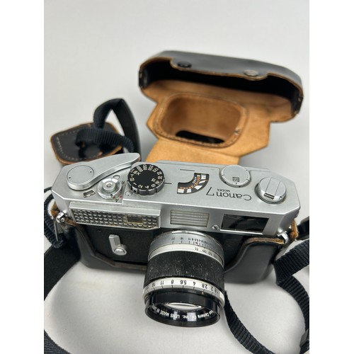 262 - A CANON MODEL 7 RANGEFINDER CAMERA WITH CANON 50MM F 1.8 LENS, in original black leather makers case... 