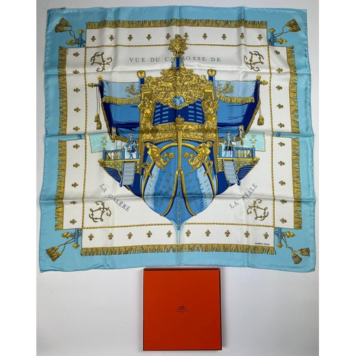 292 - AN HERMES SILK SCARF 'VUE DU CARROSSE DE LA GALERE LA REALE' IN ORIGINAL BOX, apparently unused