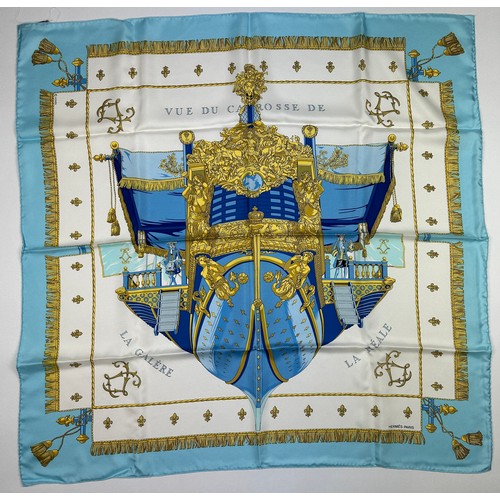 292 - AN HERMES SILK SCARF 'VUE DU CARROSSE DE LA GALERE LA REALE' IN ORIGINAL BOX, apparently unused