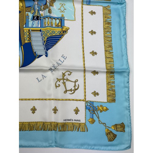 292 - AN HERMES SILK SCARF 'VUE DU CARROSSE DE LA GALERE LA REALE' IN ORIGINAL BOX, apparently unused