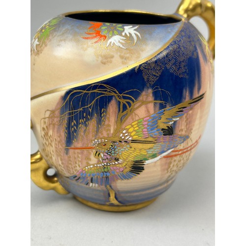 95 - CARLTON WARE 'SKETCHING BIRD' DESIGN CERAMIC VASE, gilt twin handled, glazed with painted finished.
... 