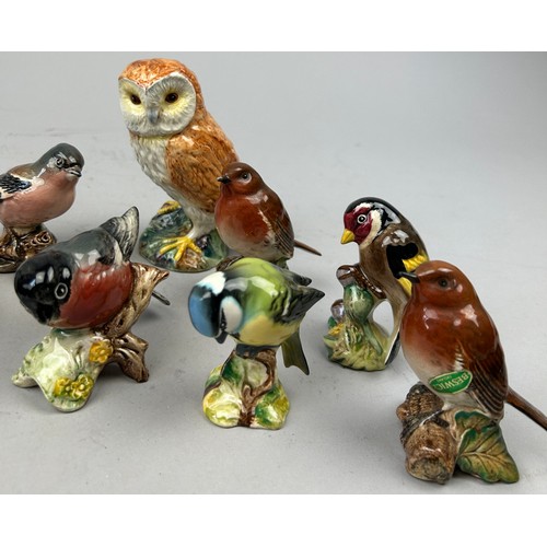 115 - A COLLECTION OF BESWICK BIRDS (9)