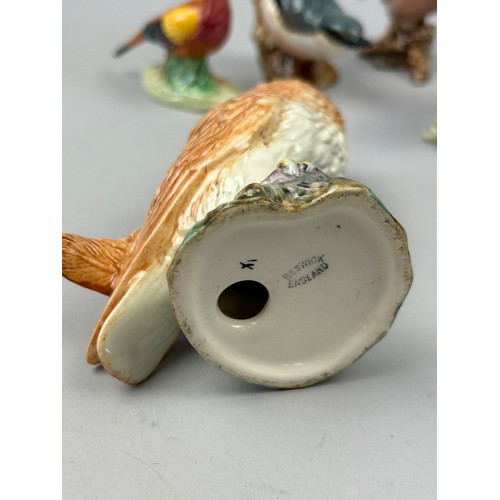 115 - A COLLECTION OF BESWICK BIRDS (9)