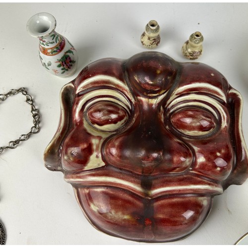 75 - A COLLECTION OF CHINESE ITEMS TO INCLUDE A YI XING TEA POT, mask of a man, small bottles and bowls.
... 