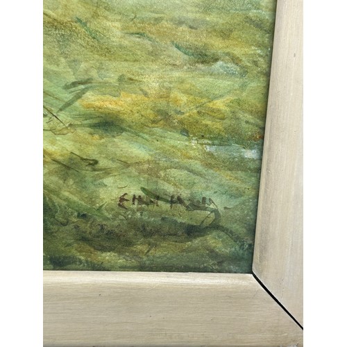 187 - A WATERCOLOUR ON PAPER OF SHEEP IN A FIELD, mounted in a frame and glazed. 

Signed indistinctly. Fo... 