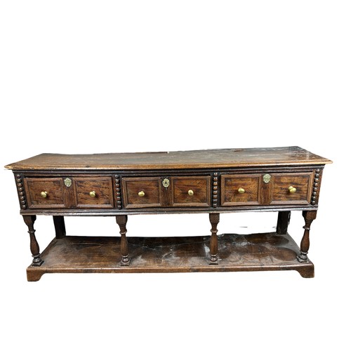 236 - A CHARLES II DRESSER OAK DRESSER BASE CIRCA 1690, possibly later additions,

The rectangular plank t... 