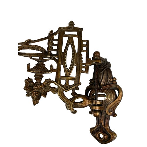 157 - THREE ART NOUVEAU WALL SCONCES, brass with winged cherubs and panthers (3)

Largest 40cm x 30cm