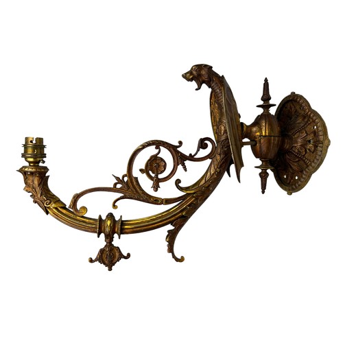 157 - THREE ART NOUVEAU WALL SCONCES, brass with winged cherubs and panthers (3)

Largest 40cm x 30cm