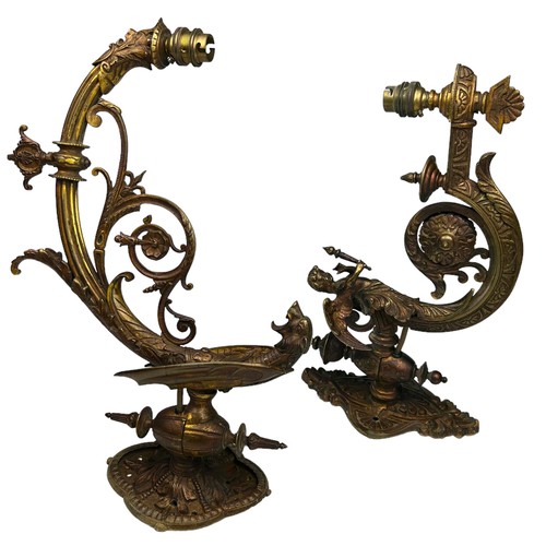 157 - THREE ART NOUVEAU WALL SCONCES, brass with winged cherubs and panthers (3)

Largest 40cm x 30cm