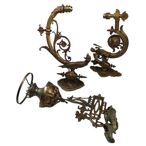 157 - THREE ART NOUVEAU WALL SCONCES, brass with winged cherubs and panthers (3)

Largest 40cm x 30cm