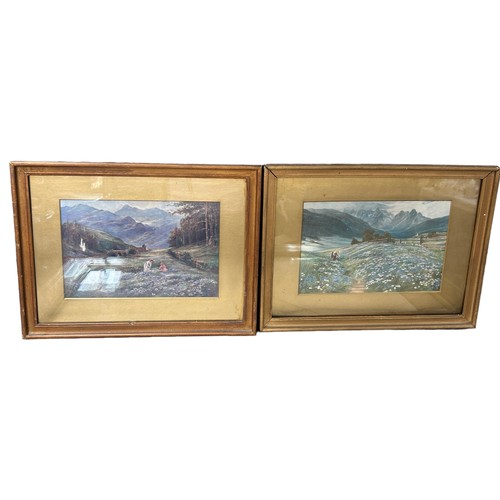 212 - TWO PRINTS OF LADIES IN FIELDS BENEATH MOUNTAIN RANGES, mounted in frames and glazed (2)