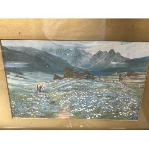 212 - TWO PRINTS OF LADIES IN FIELDS BENEATH MOUNTAIN RANGES, mounted in frames and glazed (2)