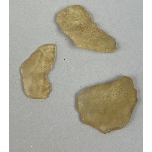 34 - THREE WORKED NEOLOTHIC LIBYAN DESERT GLASS TEKTITE FLAKES, 

Formed when an asteroid struck the Saha... 