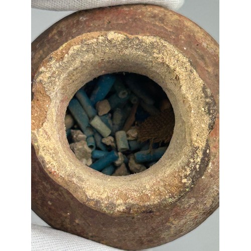 60 - AN ANCIENT EGYPTIAN FUNERARY VESSEL FILLED