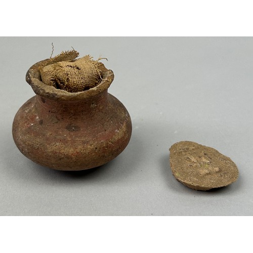 60 - AN ANCIENT EGYPTIAN FUNERARY VESSEL FILLED