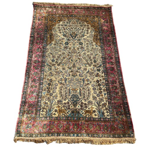 204 - A FINE TURKISH SILK HEREKE RUG DEPICTING THE TREE OF LIFE AND BIRD FIELD WITH FOLIATE BORDER

210cm ... 