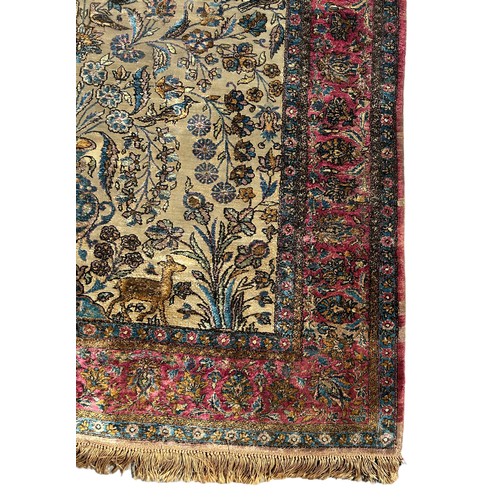 204 - A FINE TURKISH SILK HEREKE RUG DEPICTING THE TREE OF LIFE AND BIRD FIELD WITH FOLIATE BORDER

210cm ... 